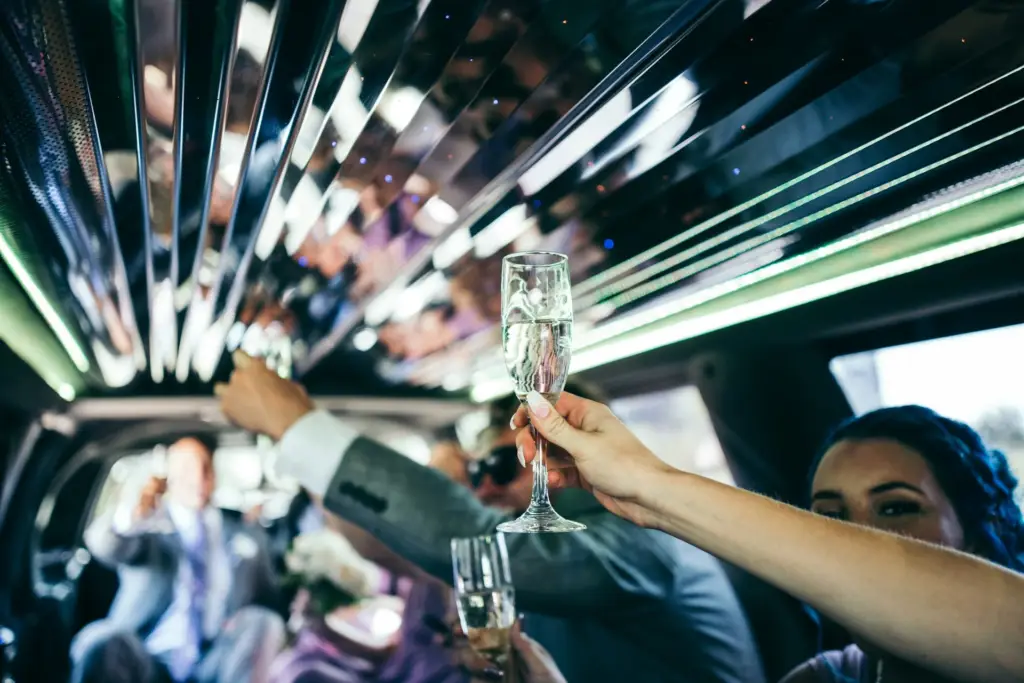 Group enjoying a Miami limo party with luxury ride, music, and nightlife vibes