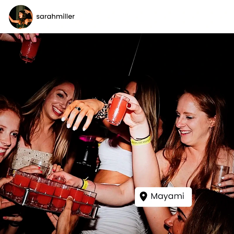 People enjoying a dinner party with a festive atmosphere in Miami