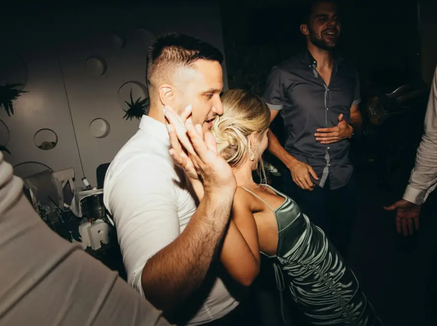 Group enjoying a party in Miami with nightlife, music, and city vibes