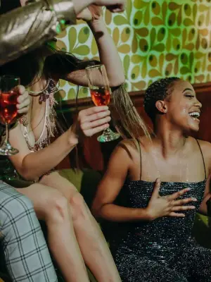 Group of friends dancing and celebrating at a lively party